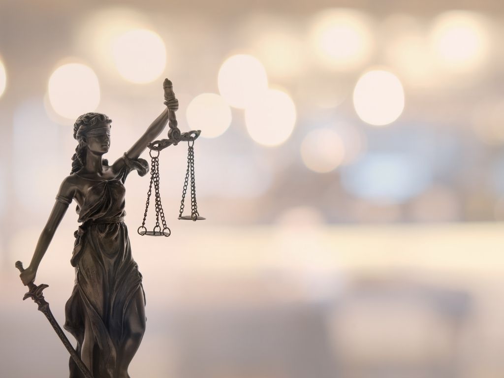 lady justice weighing the west Virginia auto accident process